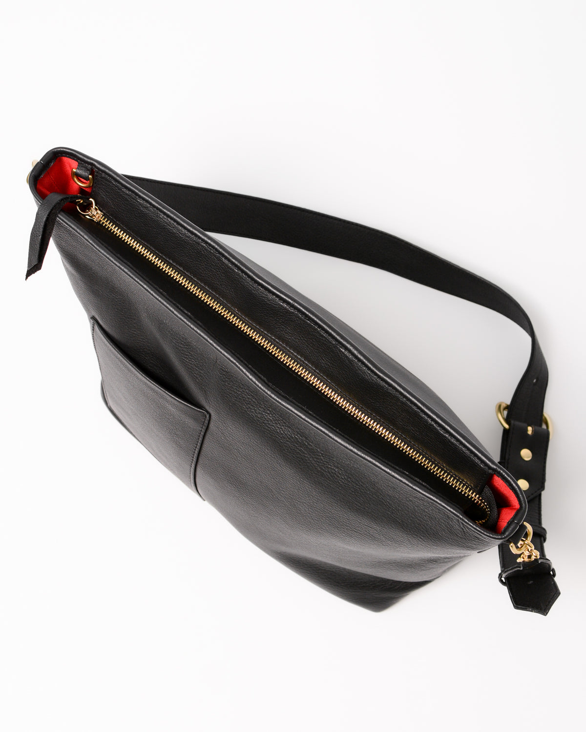 Black leather bag with gold zipper and red interior.