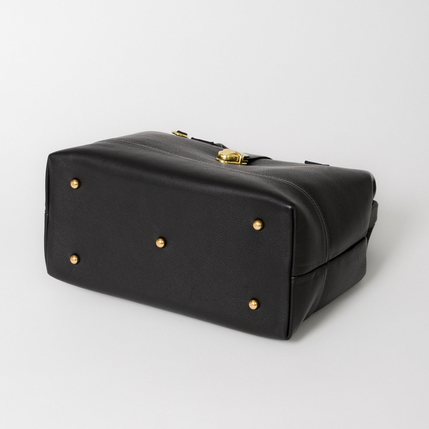 Doctor Bag bottom view showing the solid brass feet