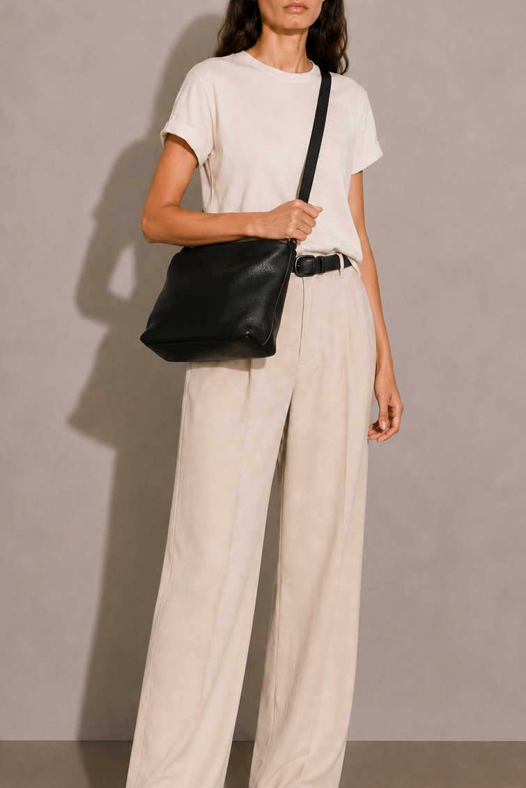 Gemma Crossbody leather bag with adjustable strap and interior pockets, gold hardware and zipper closure. 