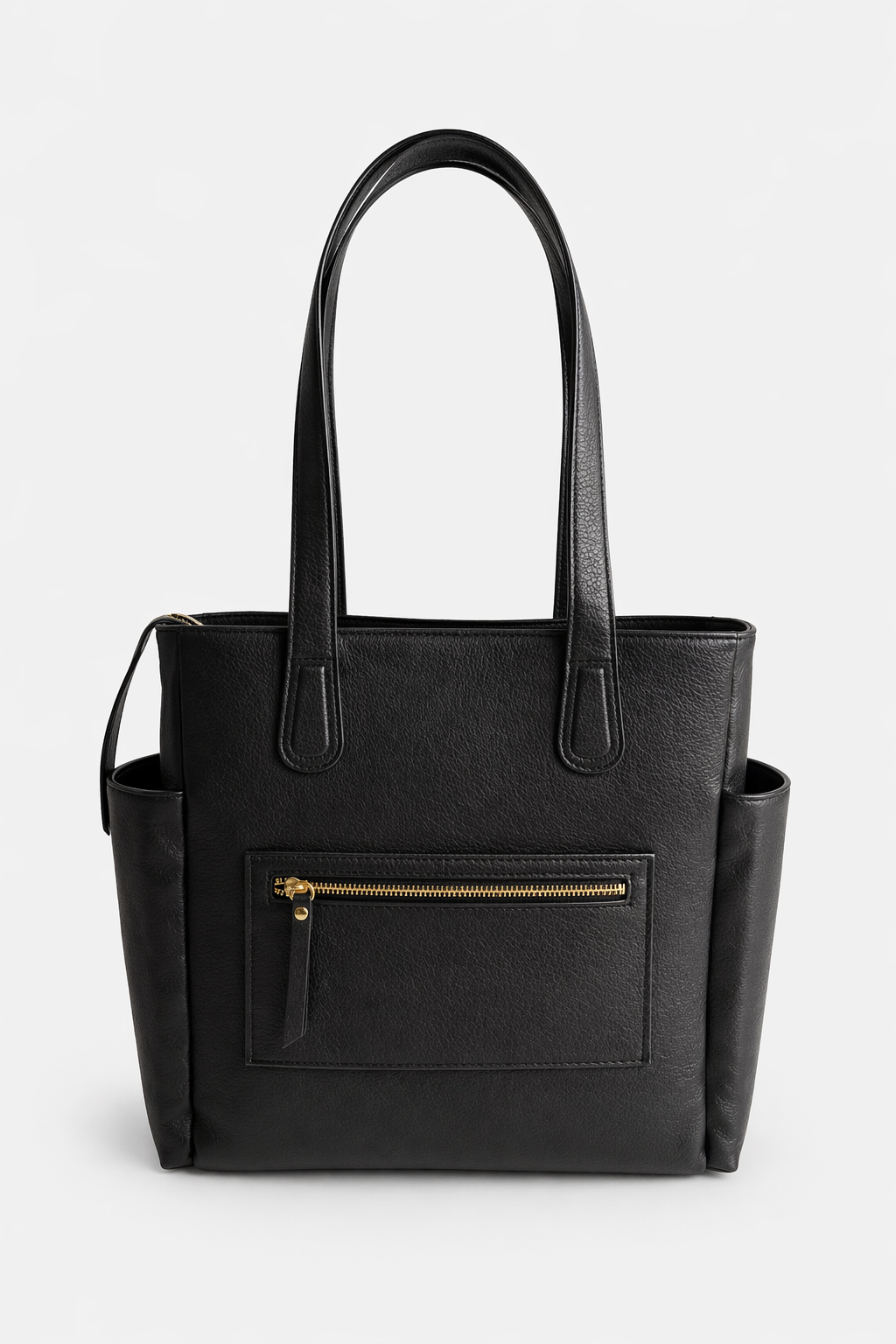 Back view of the black leather Emily Tote featuring a zip pocket that converts into a luggage sleeve for travel convenience.