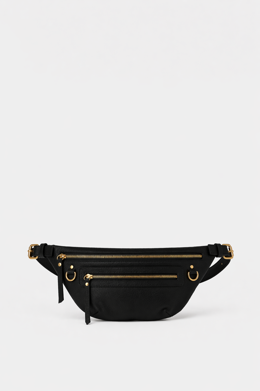Black leather fanny pack belt bag with adjustable strap, multiple zip pockets, and gold hardware, designed as a hands-free everyday bag for travel, errands, and on-the-go essentials.